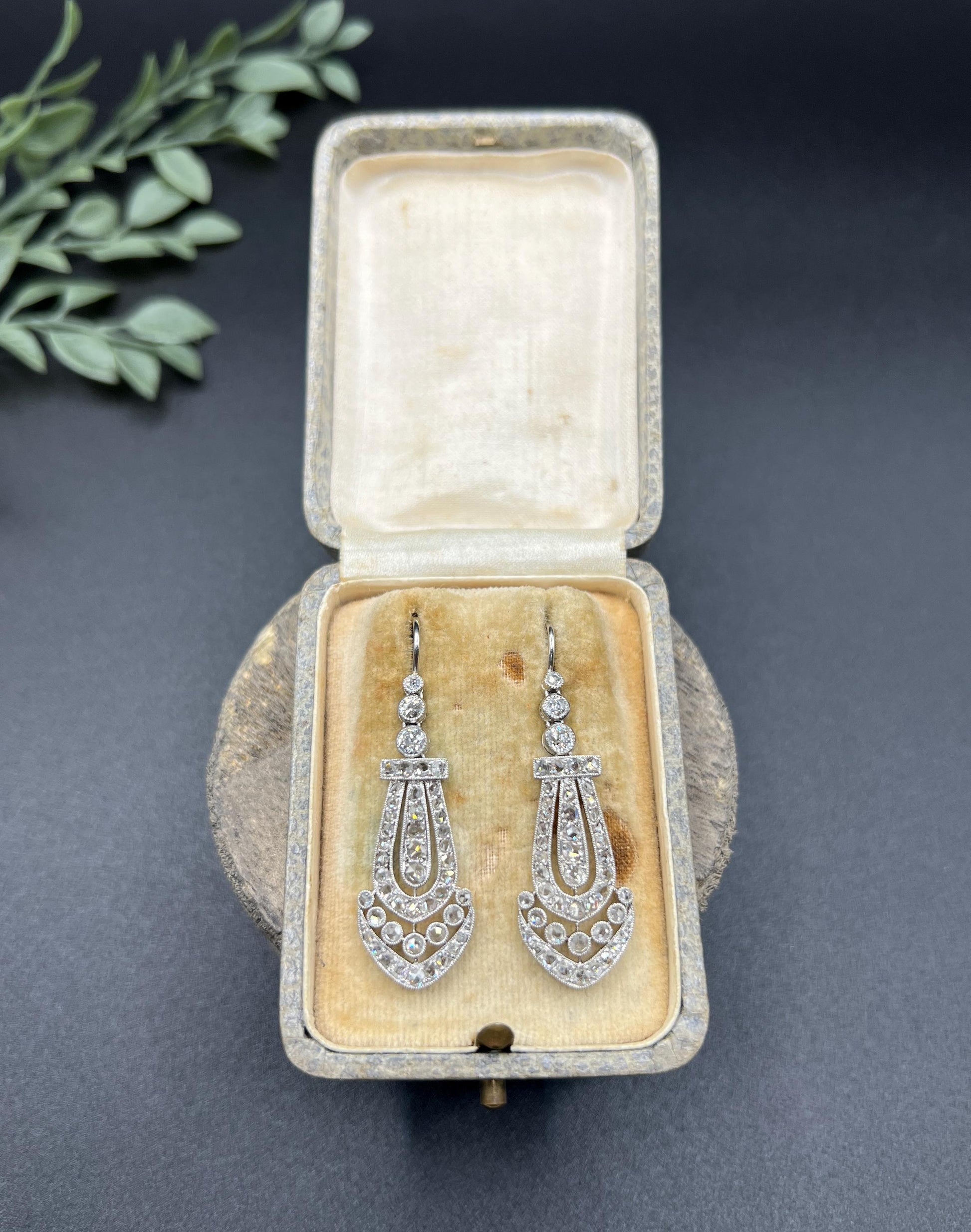 A pair of antique platinum diamond drop earrings, in a box