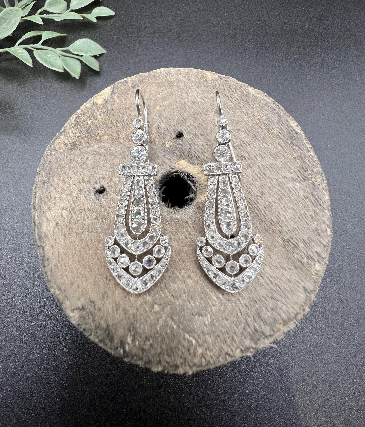 A pair of antique platinum diamond drop earrings