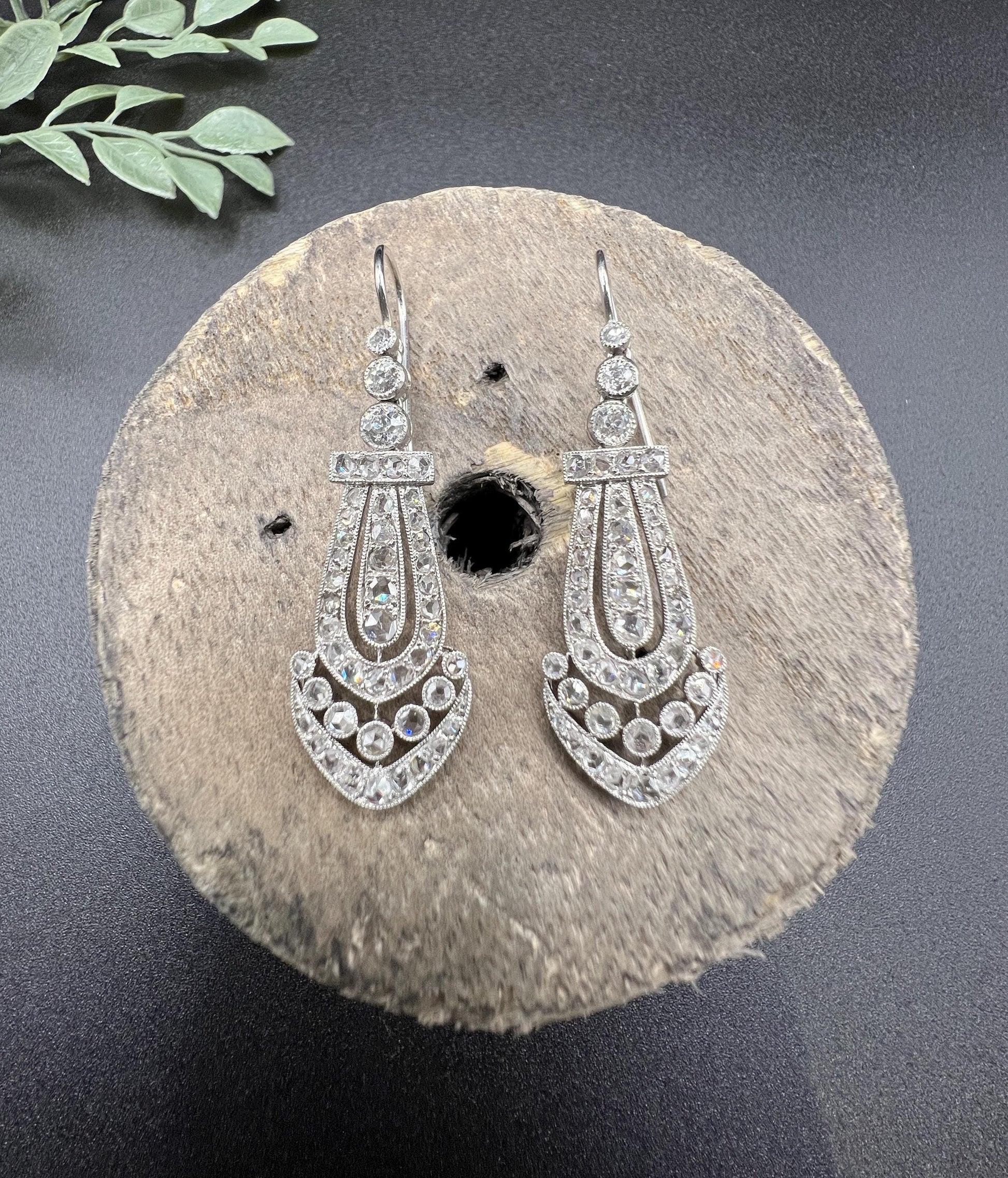 A pair of antique platinum diamond drop earrings