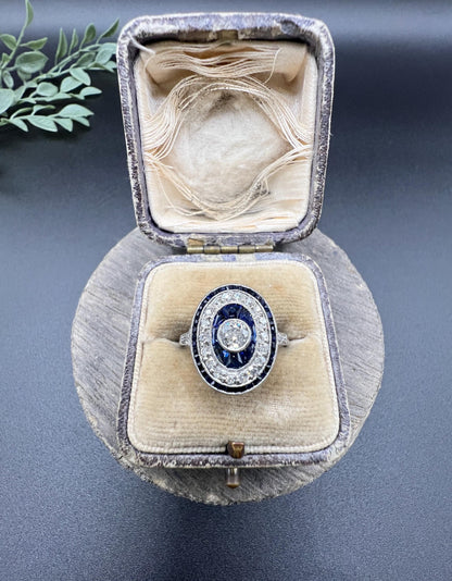 Antique Platinum, Edwardian era Sapphire & Diamond Oval Halo Cluster ring