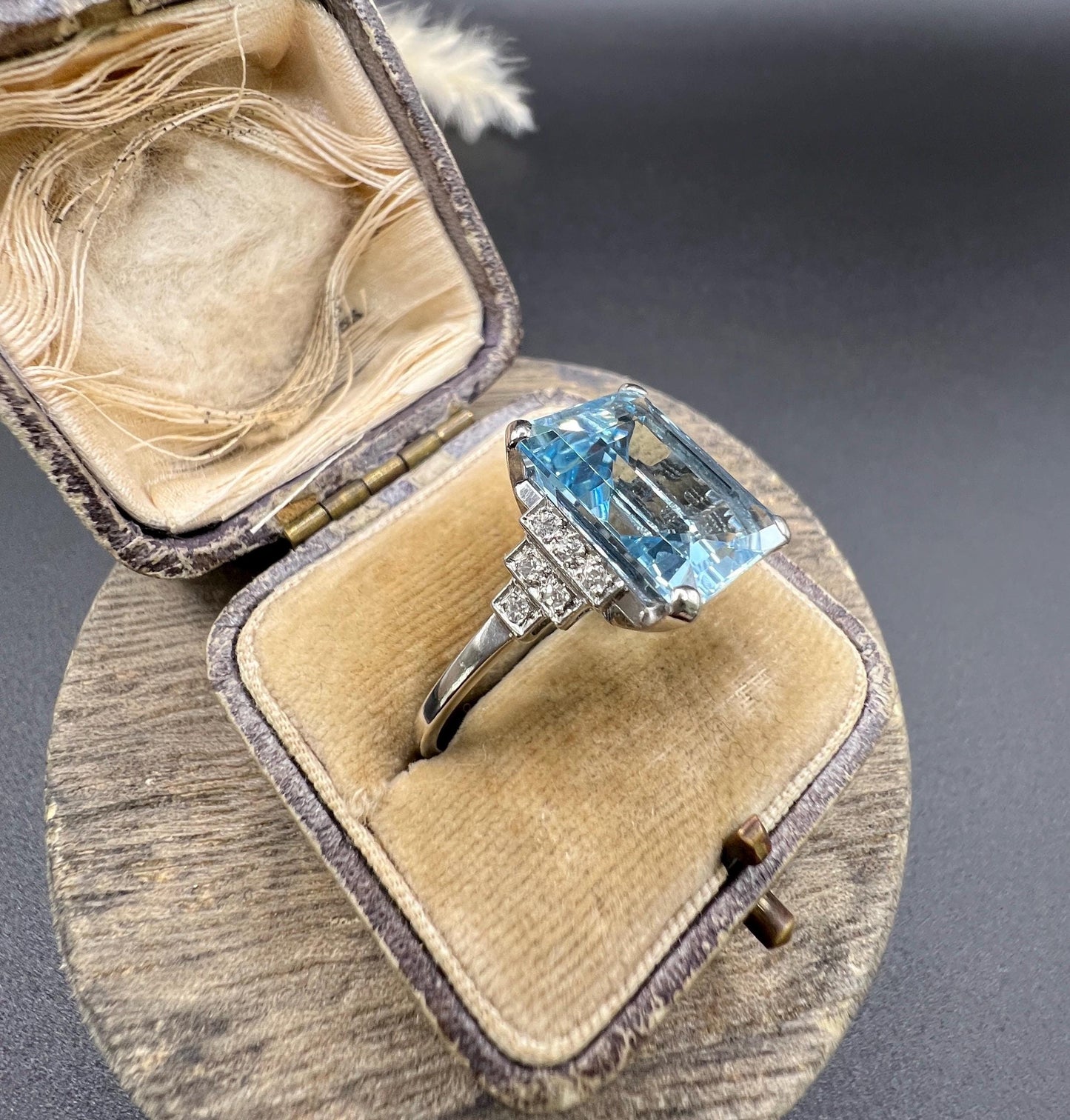 A large aquamarine and diamond dress ring in platinum, in a ring box