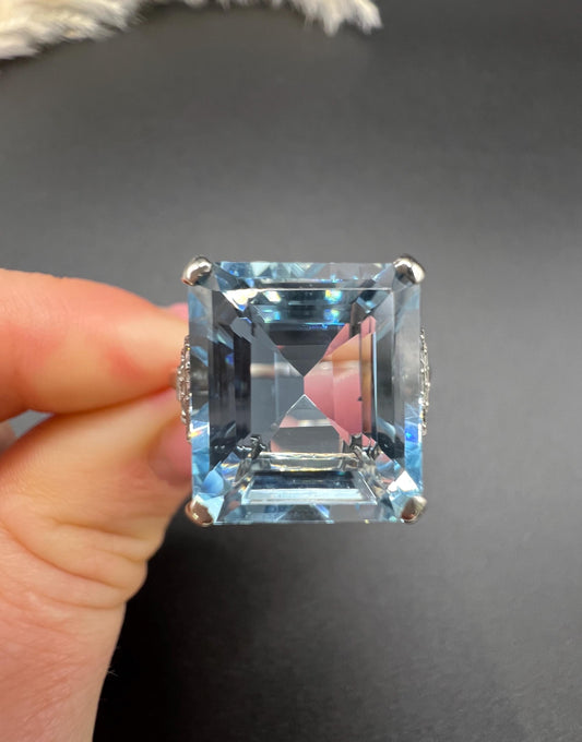 A large aquamarine and diamond dress ring in platinum
