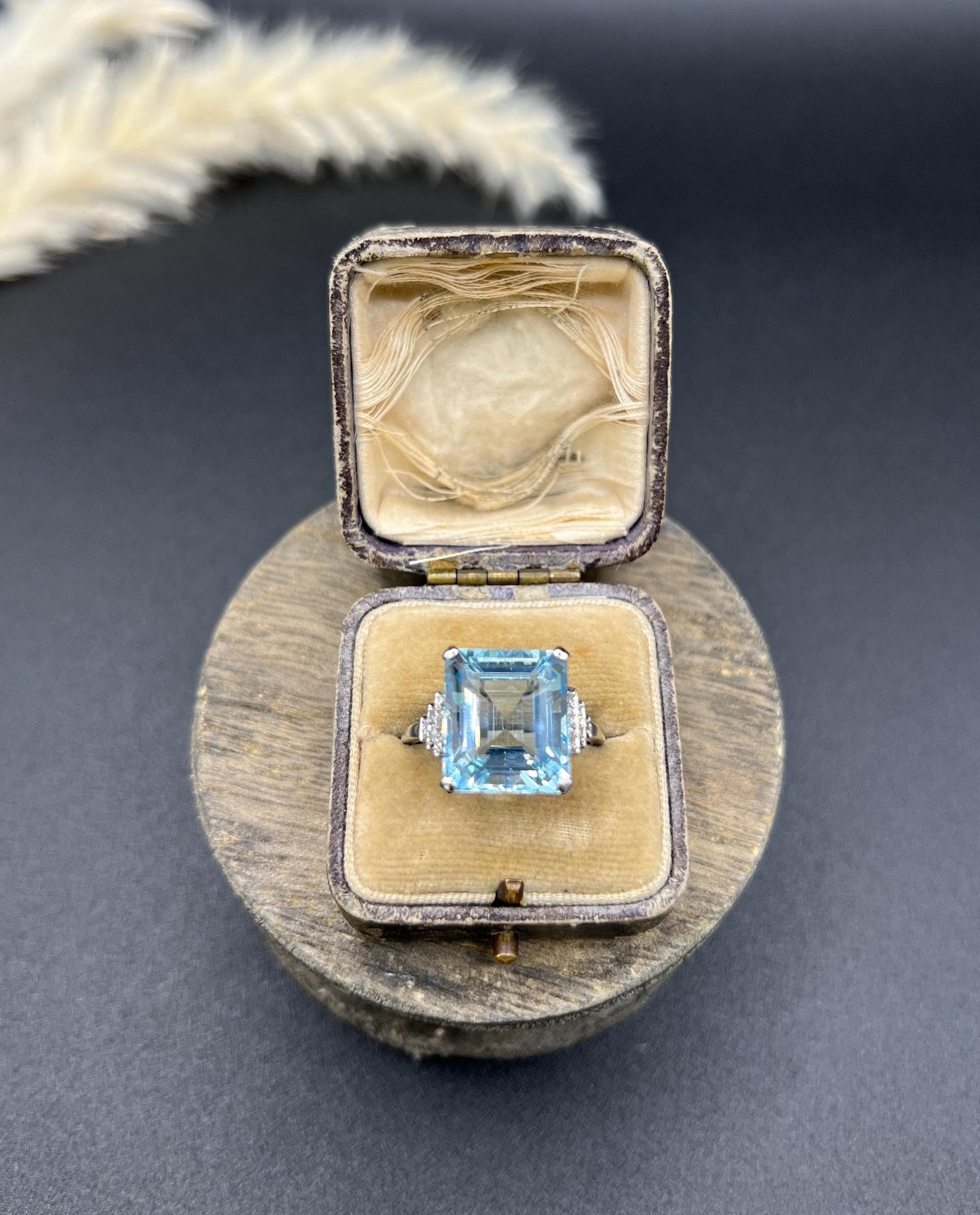 A large aquamarine and diamond dress ring in platinum, in a ring box