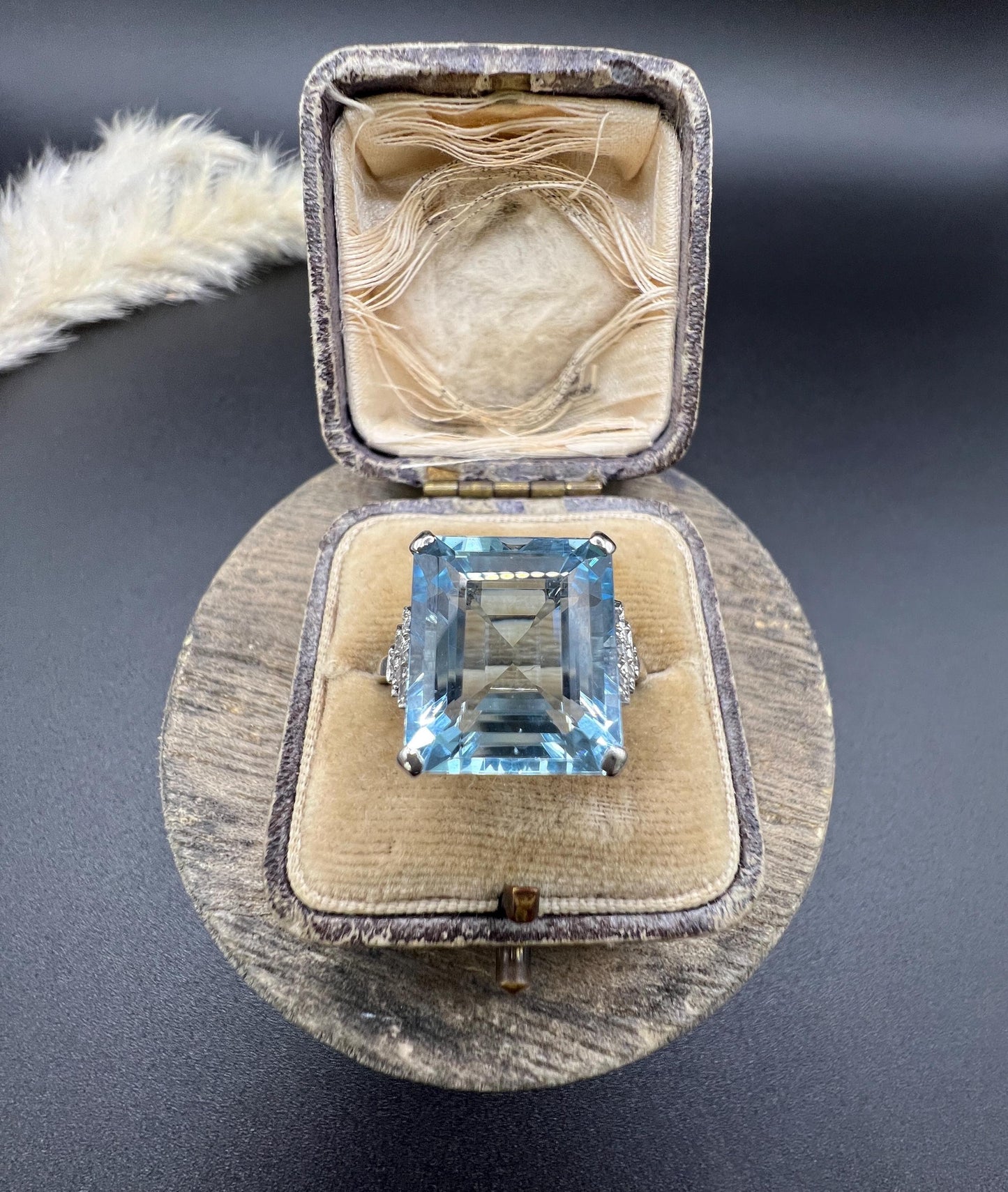 A large aquamarine and diamond dress ring in platinum, in a ring box