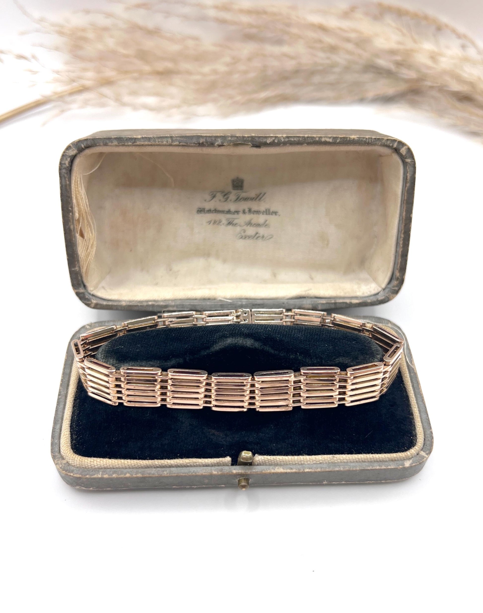 A yellow-rose gold gate style bracelet, in an antique box