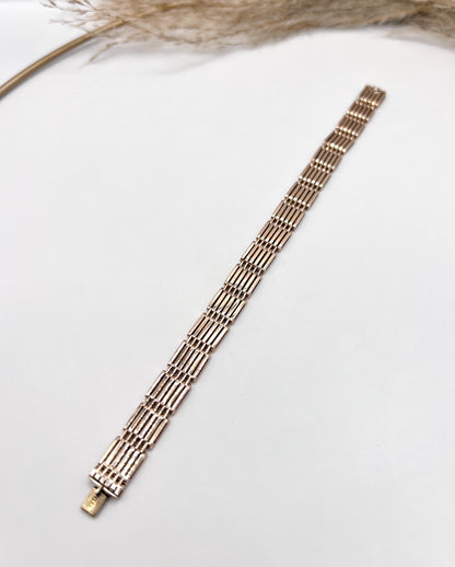 A yellow-rose gold gate style bracelet