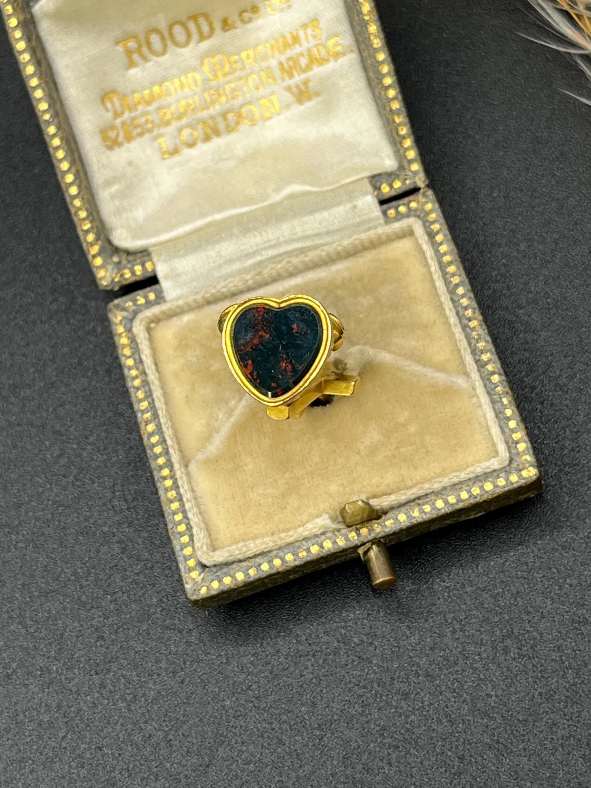 A yellow gold faith, hope and charity fob, with a heart-shaped bloodstone base