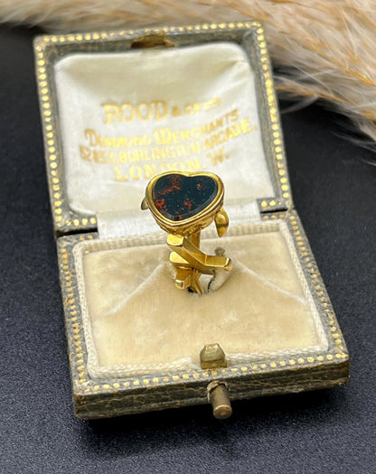 A yellow gold faith, hope and charity fob, with a heart-shaped bloodstone base