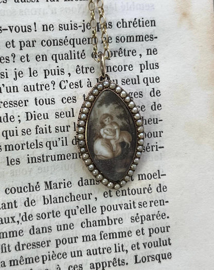 A navette shaped yellow gold seed pearl pendant with a miniature portrait, with a chain