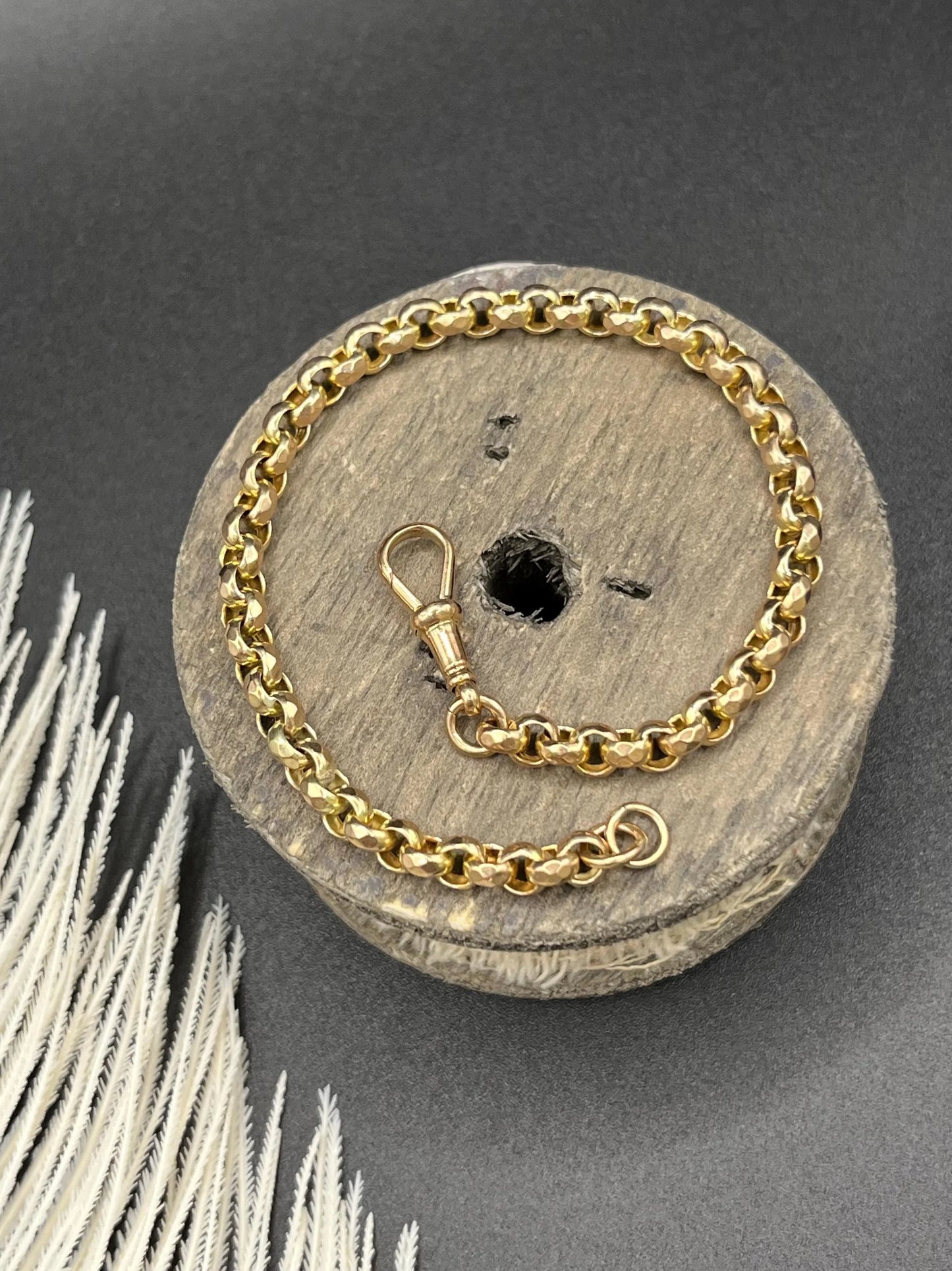 A yellow gold round link bracelet with a lobster claw clasp