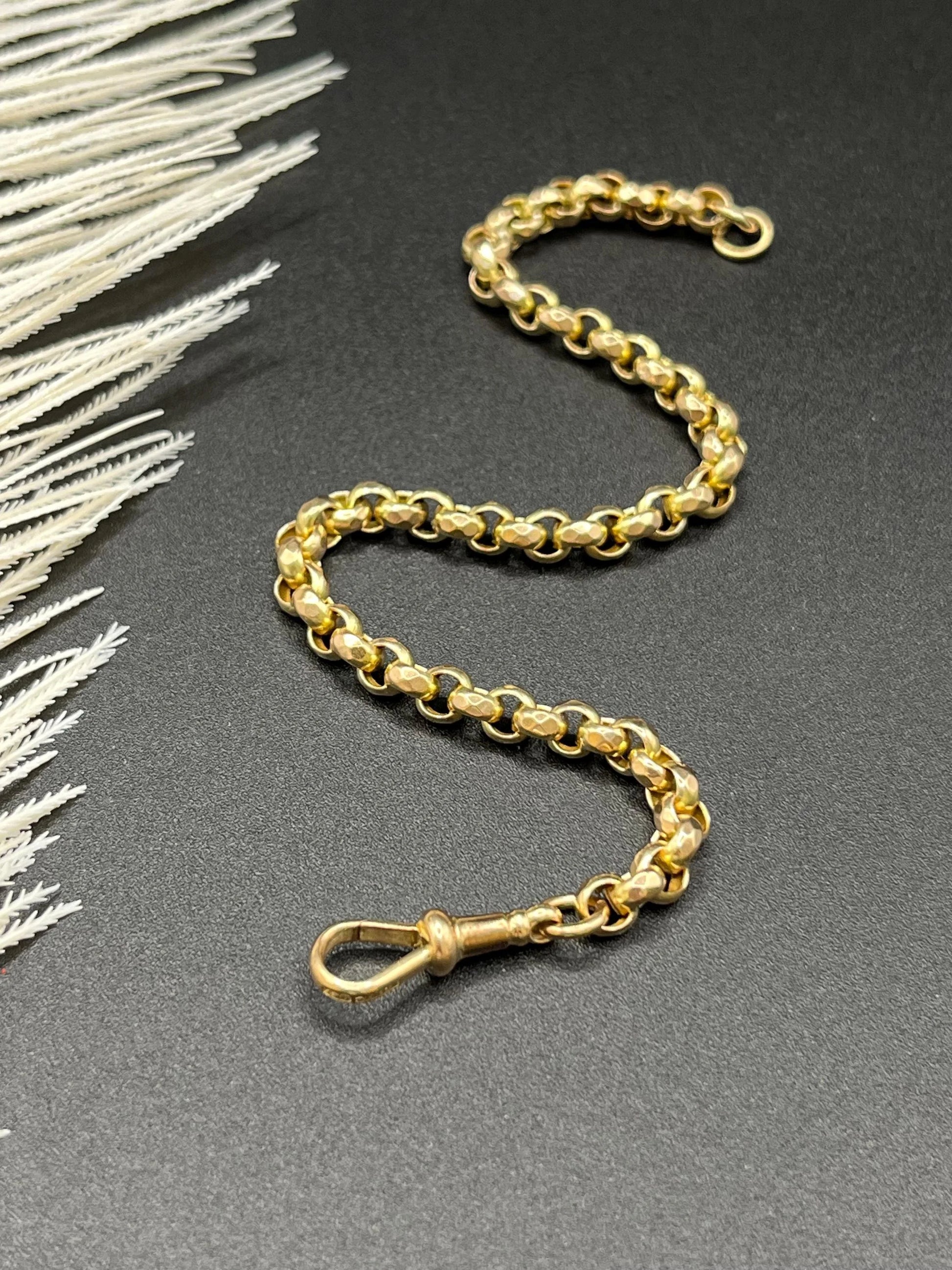 A yellow gold round link bracelet with a lobster claw clasp