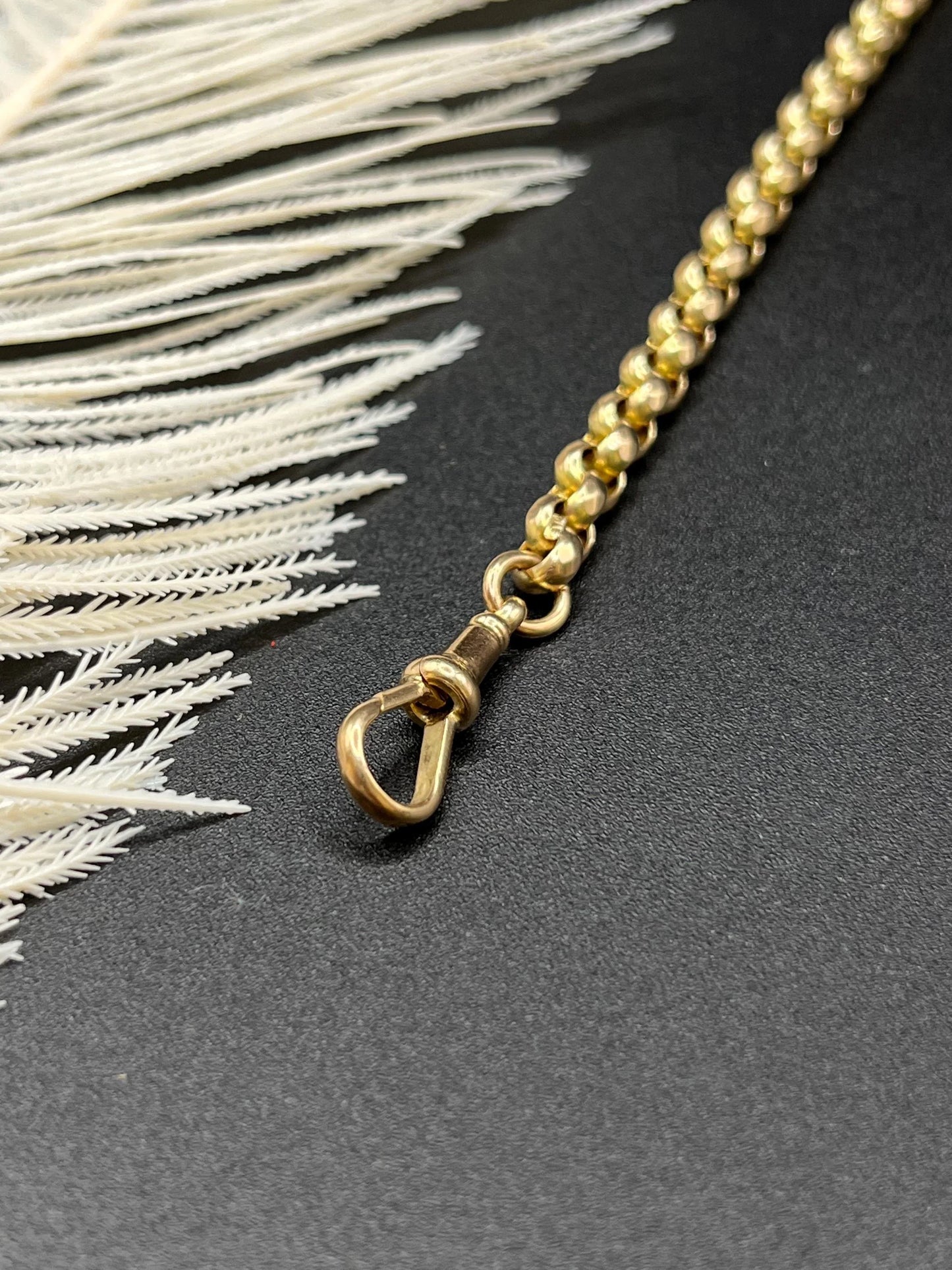 A yellow gold round link bracelet with a lobster claw clasp