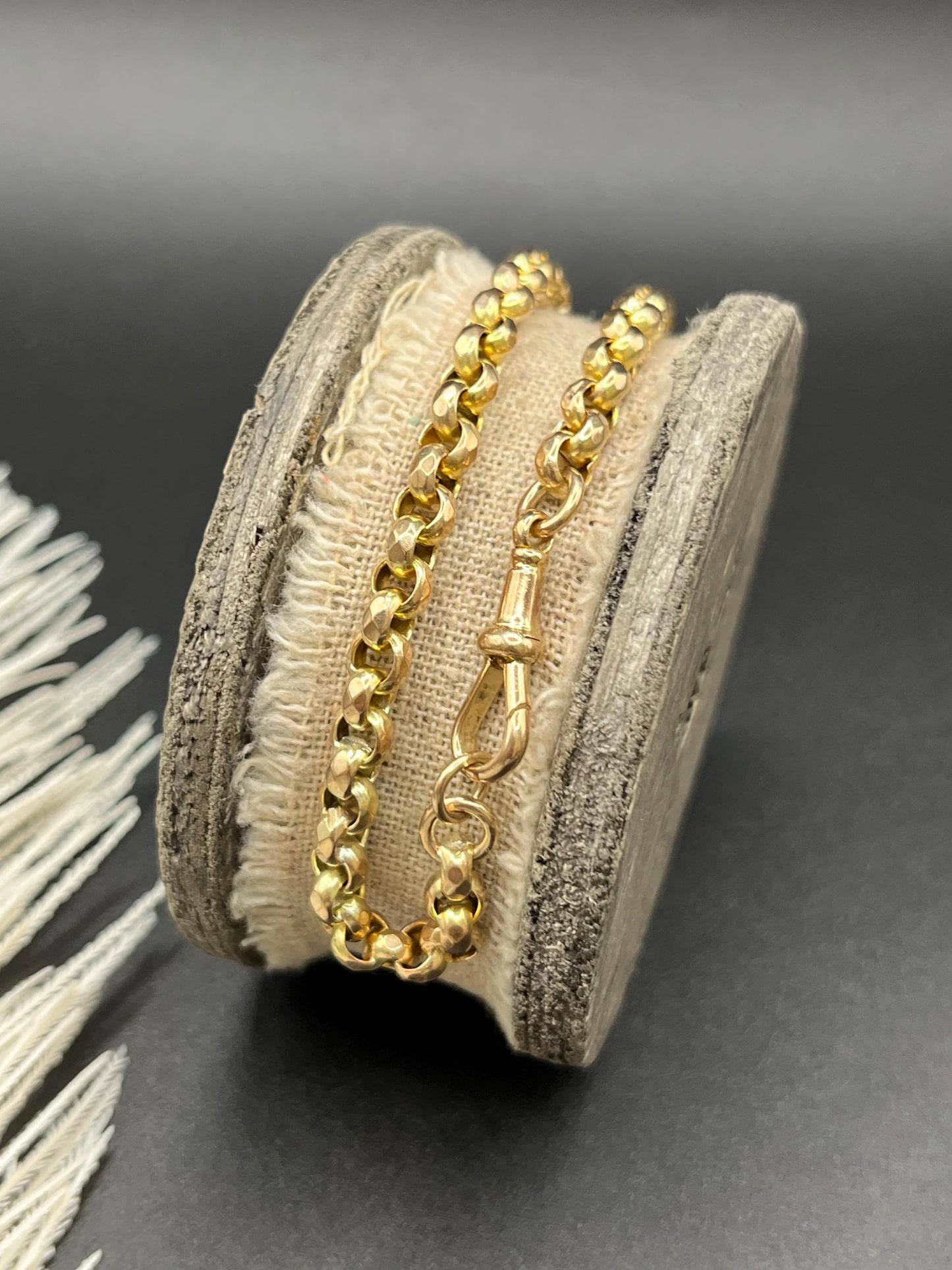 A yellow gold round link bracelet with a lobster claw clasp