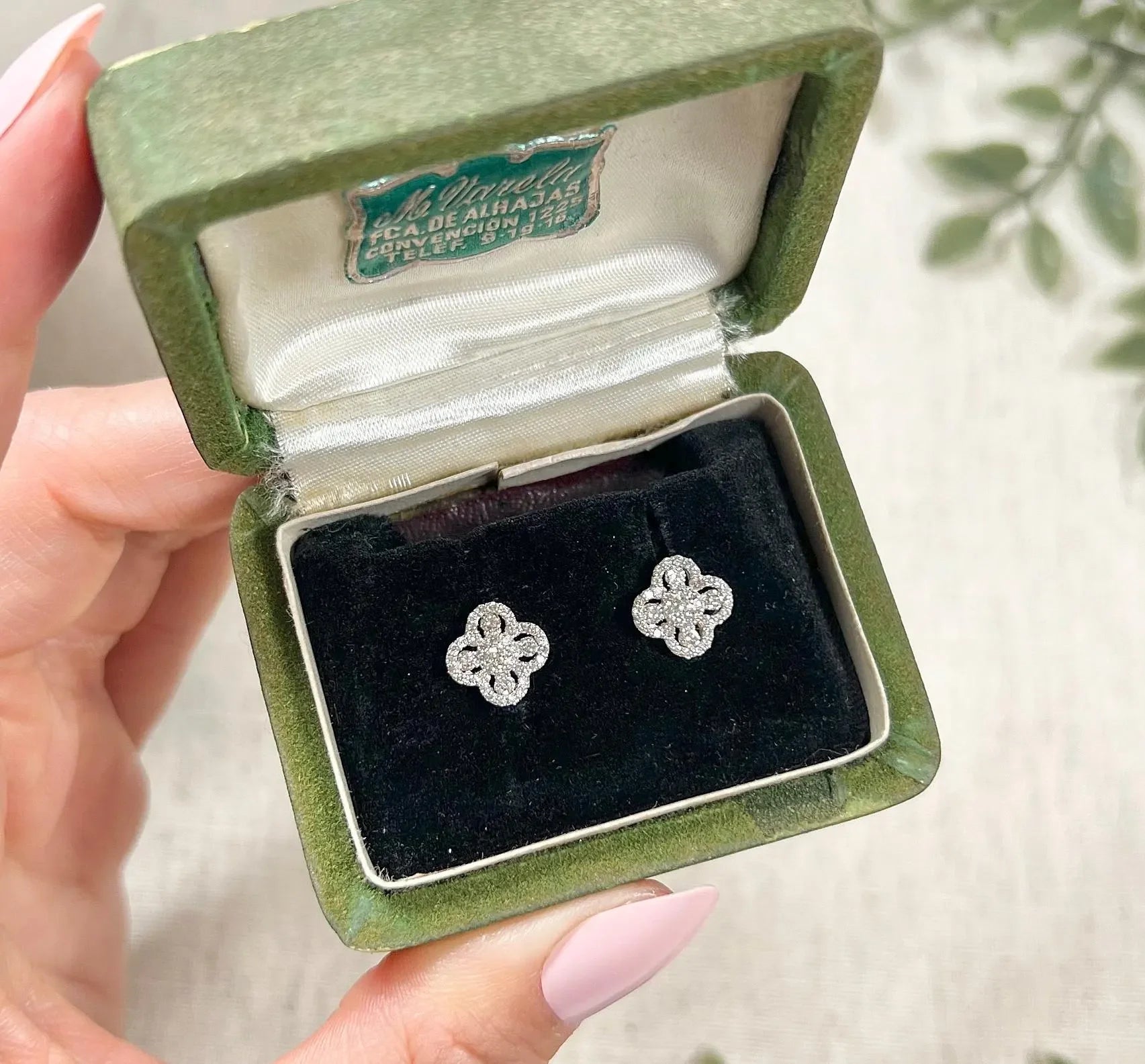 A pair of white gold clover shaped diamond cluster stud earrings, in a box