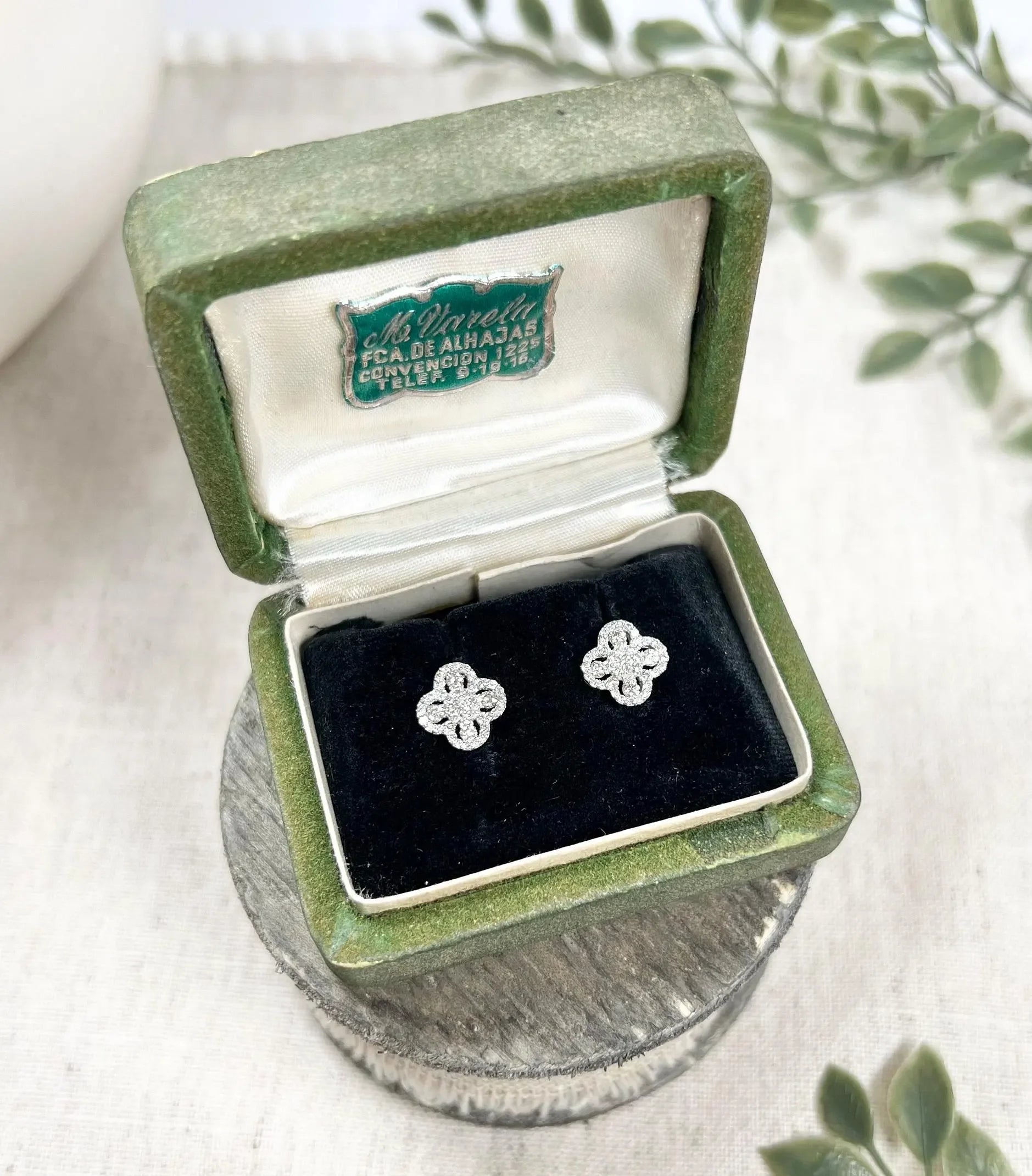 A pair of white gold clover shaped diamond cluster stud earrings, in a box