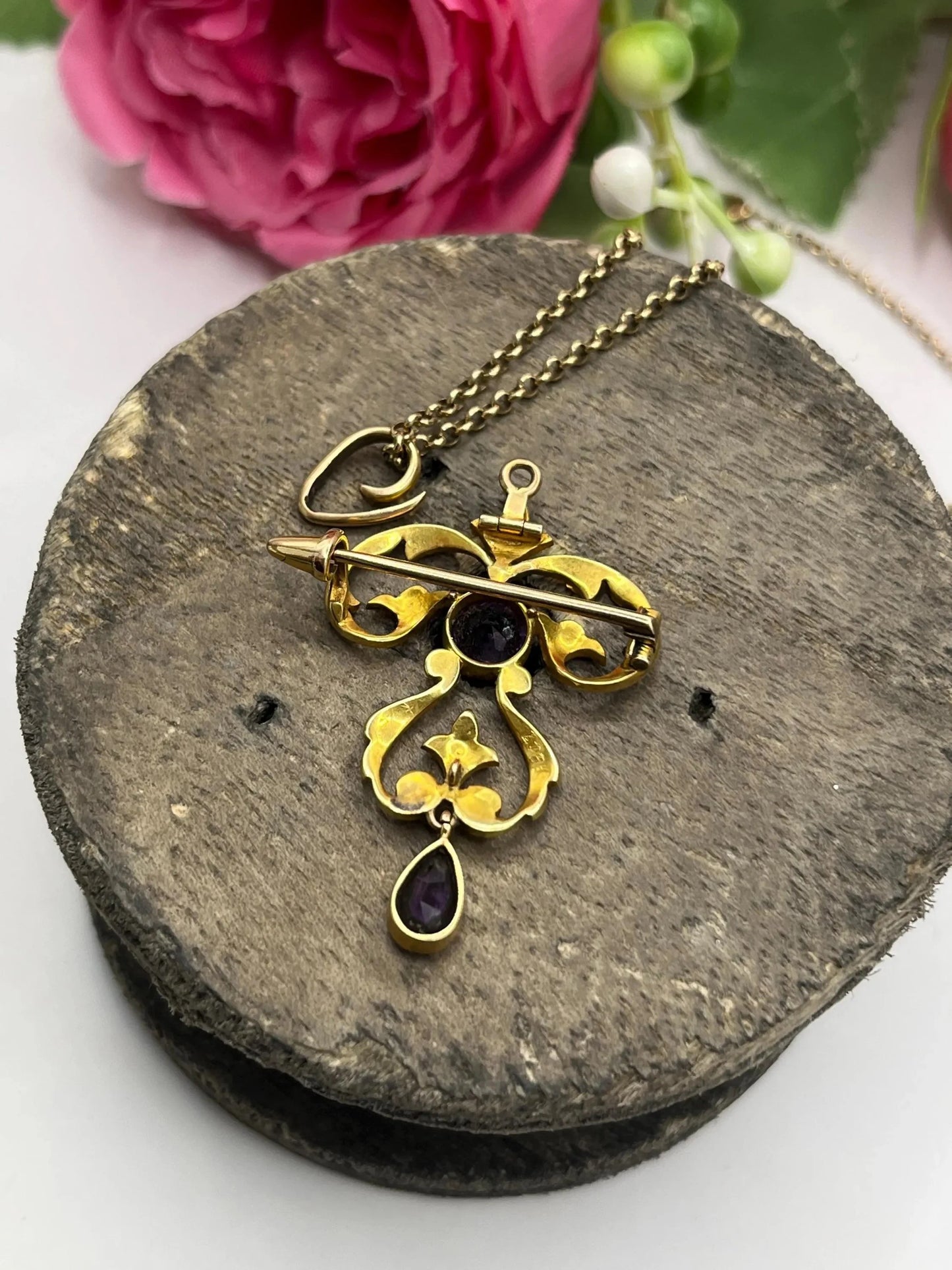 A yellow gold amethyst and seed pearl pendant/brooch, with a gold chain