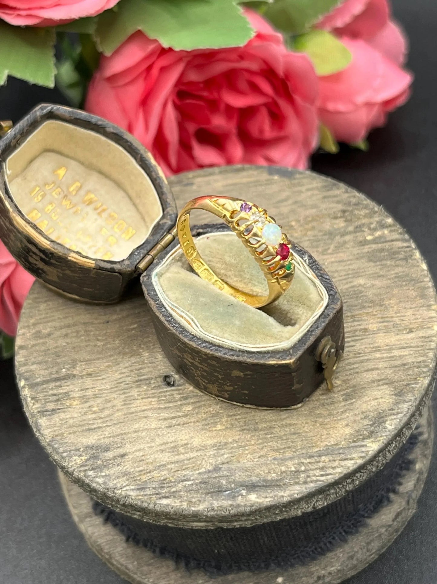 A yellow gold multi-gemstone acrostic ring, in an antique ring box