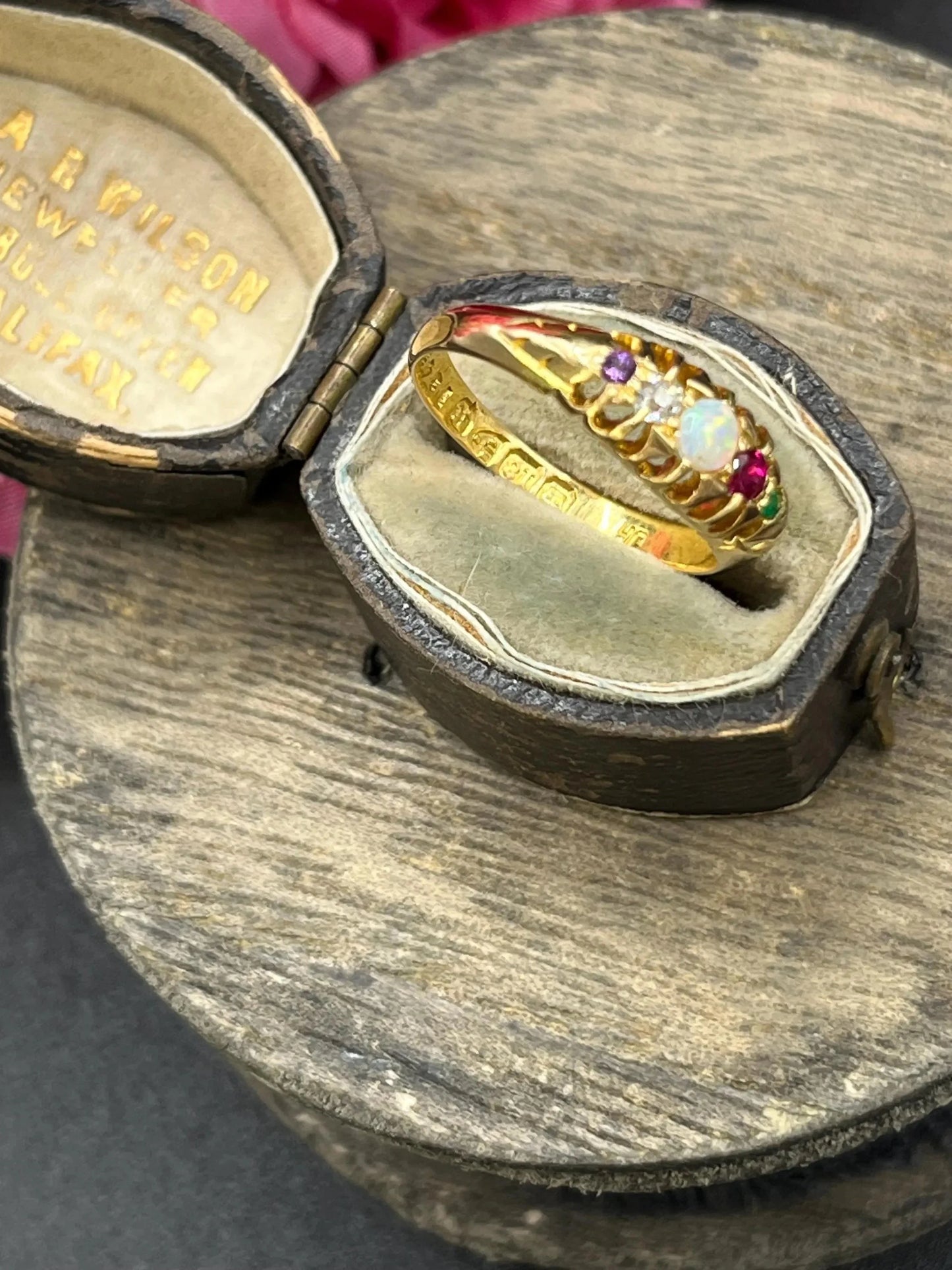 A yellow gold multi-gemstone acrostic ring, in an antique ring box