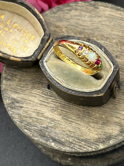 A yellow gold multi-gemstone acrostic ring, in an antique ring box