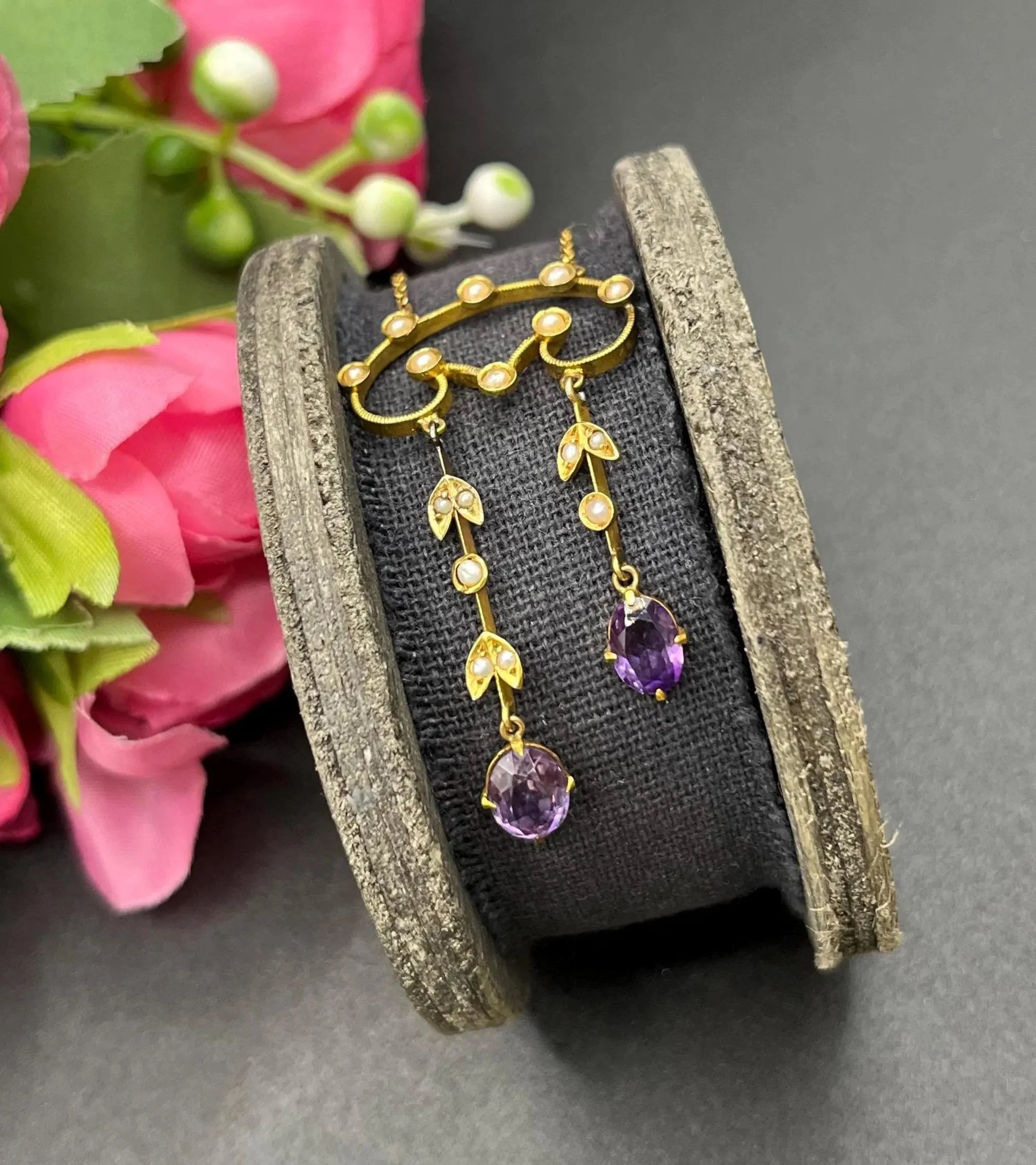An amethyst and seed pearl drop pendant necklace in yellow gold