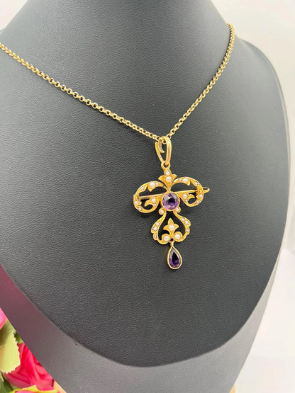 A yellow gold amethyst and seed pearl pendant/brooch, with a gold chain