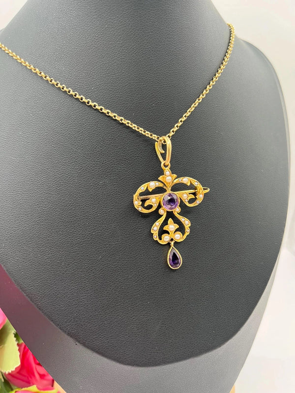 A yellow gold amethyst and seed pearl pendant/brooch, with a gold chain