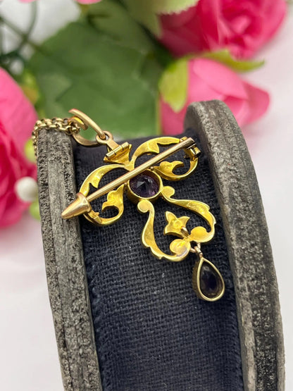 A yellow gold amethyst and seed pearl pendant/brooch, with a gold chain