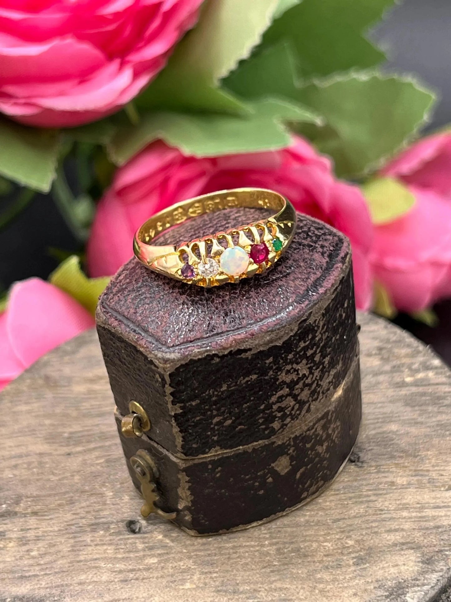 A yellow gold multi-gemstone acrostic ring, in an antique ring box