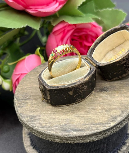A yellow gold multi-gemstone acrostic ring, in an antique ring box