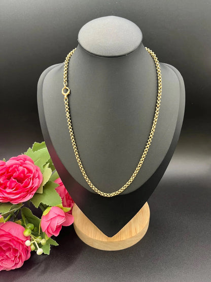 A yellow gold belcher link chain necklace, on a black jewellery bust