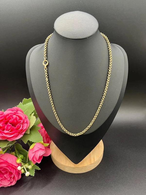 A yellow gold belcher link chain necklace, on a black jewellery bust