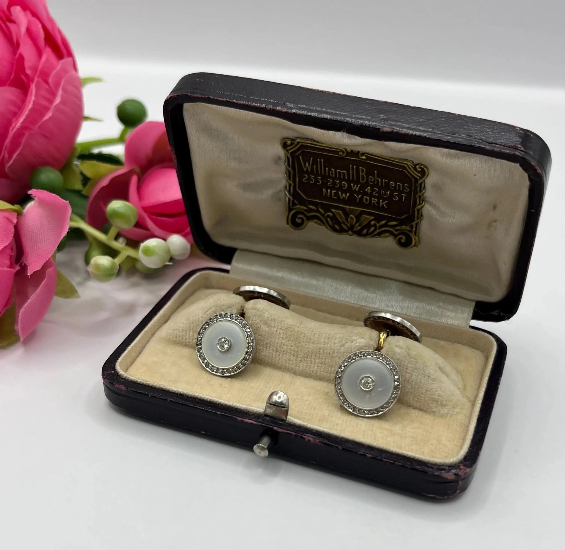 A pair of round diamond and mother of pearl cufflinks in yellow and white gold, in an antique box