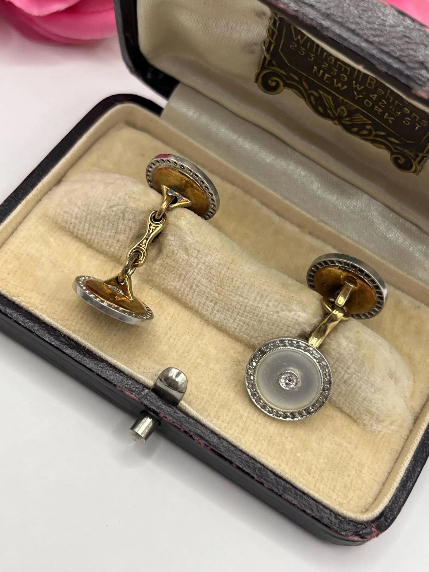 A pair of round diamond and mother of pearl cufflinks in yellow and white gold, in an antique box