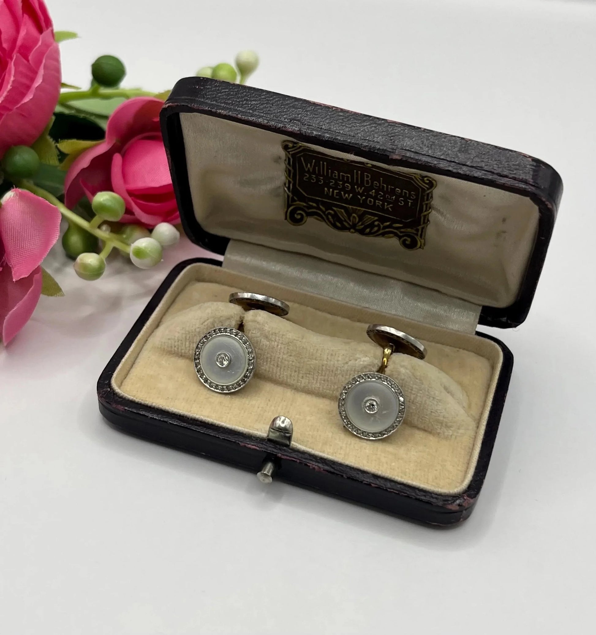 A pair of round diamond and mother of pearl cufflinks in yellow and white gold, in an antique box