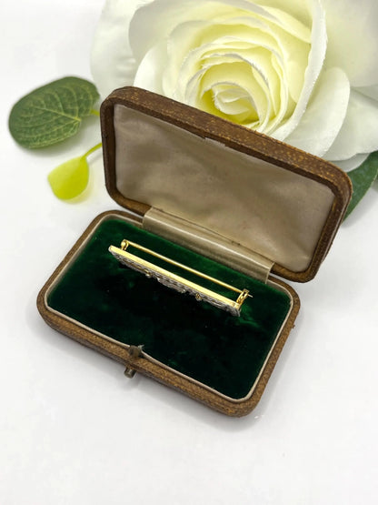A rectangular brooch with sapphire, pearls and diamonds in gold and platinum, in an antique box