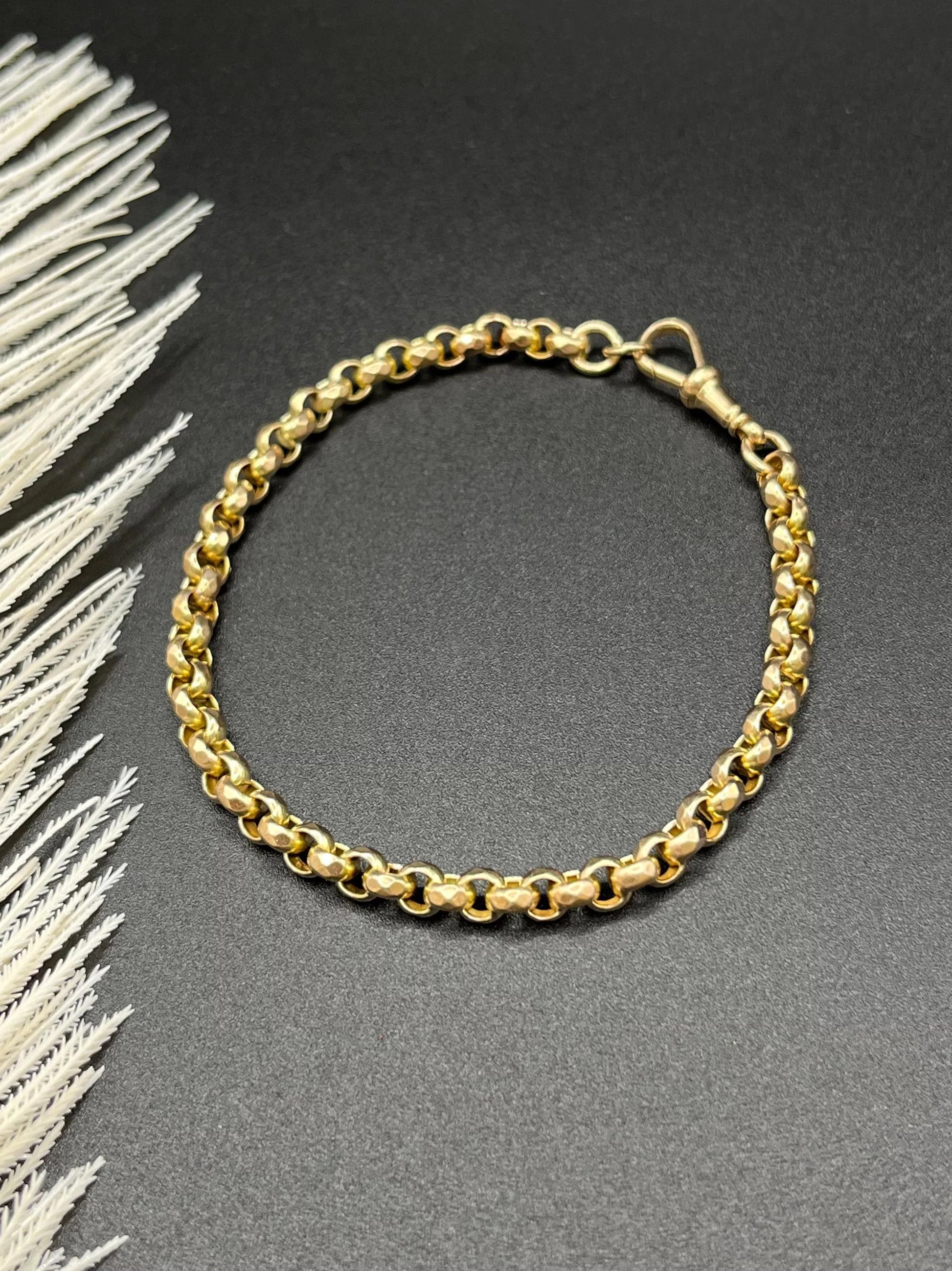 A yellow gold round link bracelet with a lobster claw clasp