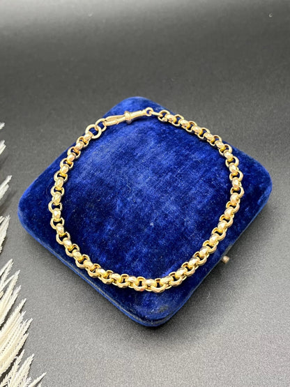 A yellow gold round link bracelet with a lobster claw clasp