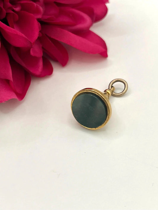 A yellow gold fob pendant with a bloodstone base