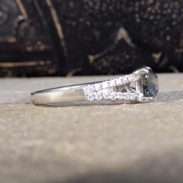 Teal sapphire and diamond ring in platinum.