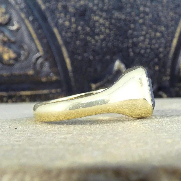 Gents black diamond signet ring in yellow gold.