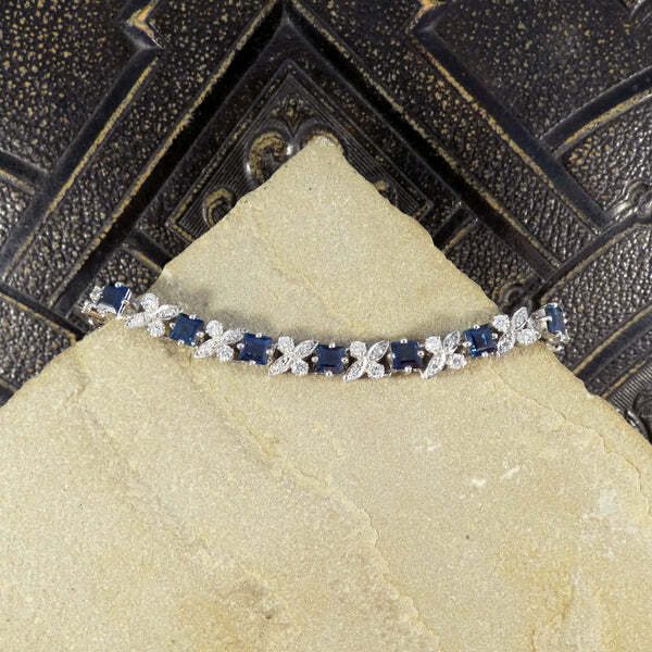 Sapphire and diamond line bracelet in white gold.