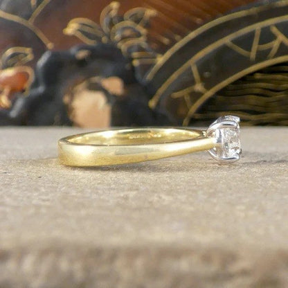 Diamond engagement ring in yellow and white gold. 