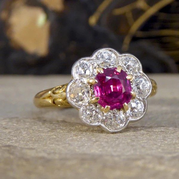 Ruby and diamond cluster ring in yellow and white gold.