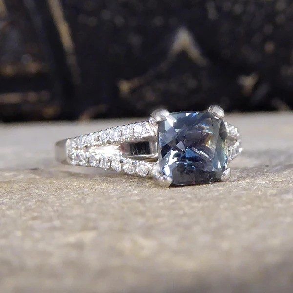 Teal sapphire and diamond ring in platinum.