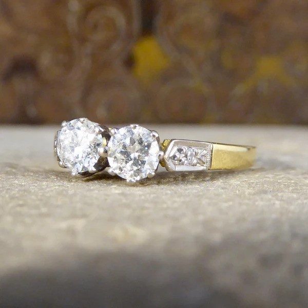 Diamond two stone ring set in white and yellow gold. 