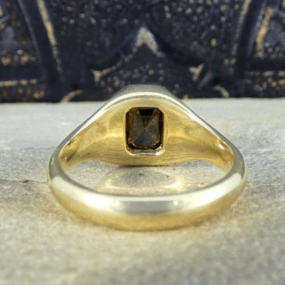 Gents black diamond signet ring in yellow gold.