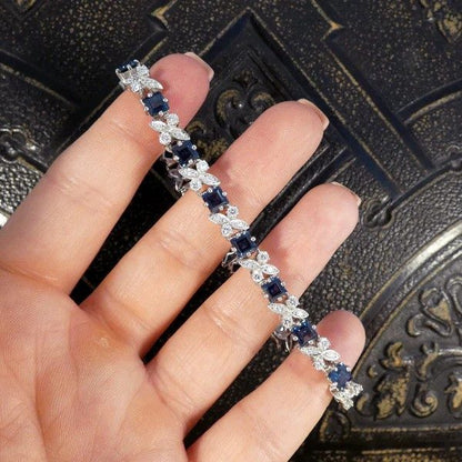 Sapphire and diamond line bracelet in white gold.