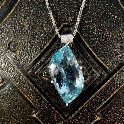 Aquamarine and diamond pendant with white gold chain.