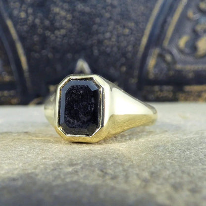 Gents black diamond signet ring in yellow gold.