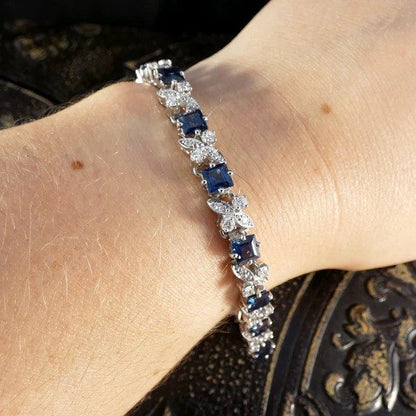 Sapphire and diamond line bracelet in white gold.